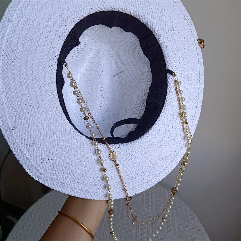 Back Of panama hat with applique and chain