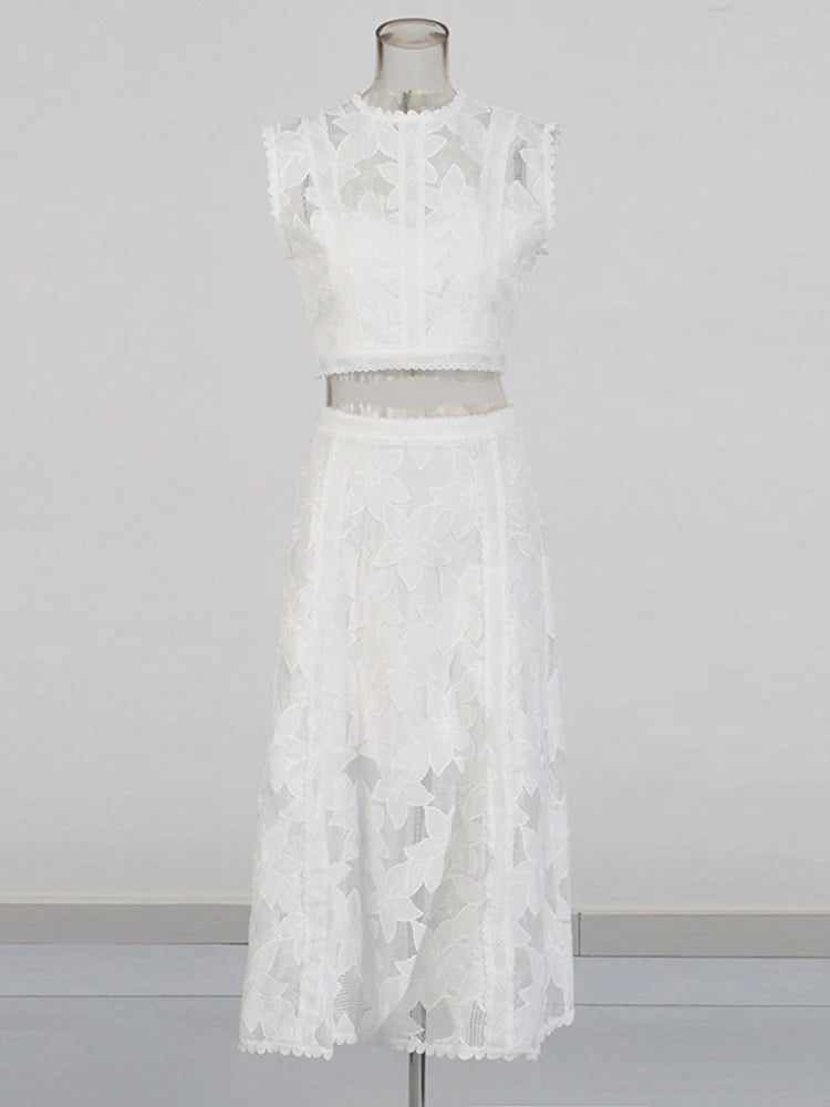 Zalia Atelier | A white two-piece outfit set featuring a sleeveless top with an O-neck and a high-waisted A-line skirt.